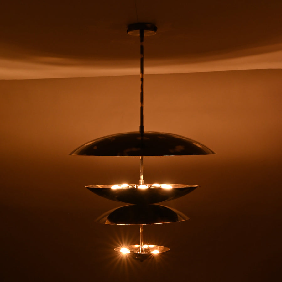 24-inch multi-tier brass disc chandelier with sculptural layered design and polished finish