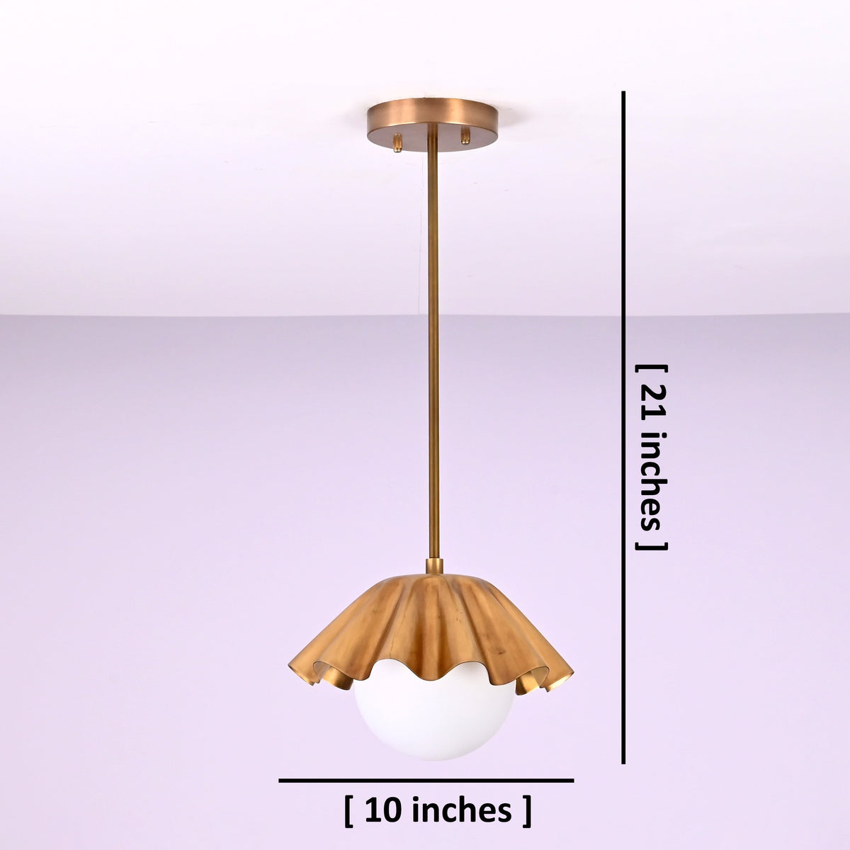 Modern brass disc pendant light showing 10 inch diameter and 21 inch drop for size reference.