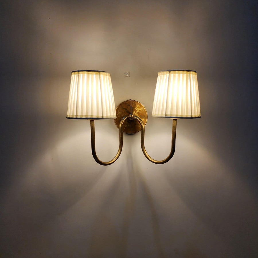 Handmade brass double arm wall sconce with pleated fabric shades – front view