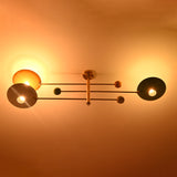Three light brass flush mount ceiling light casting warm indirect ambient lighting across the ceiling