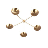 Top view of modern brass flushmount chandelier showcasing symmetrical bowl-shaped light arrangement.