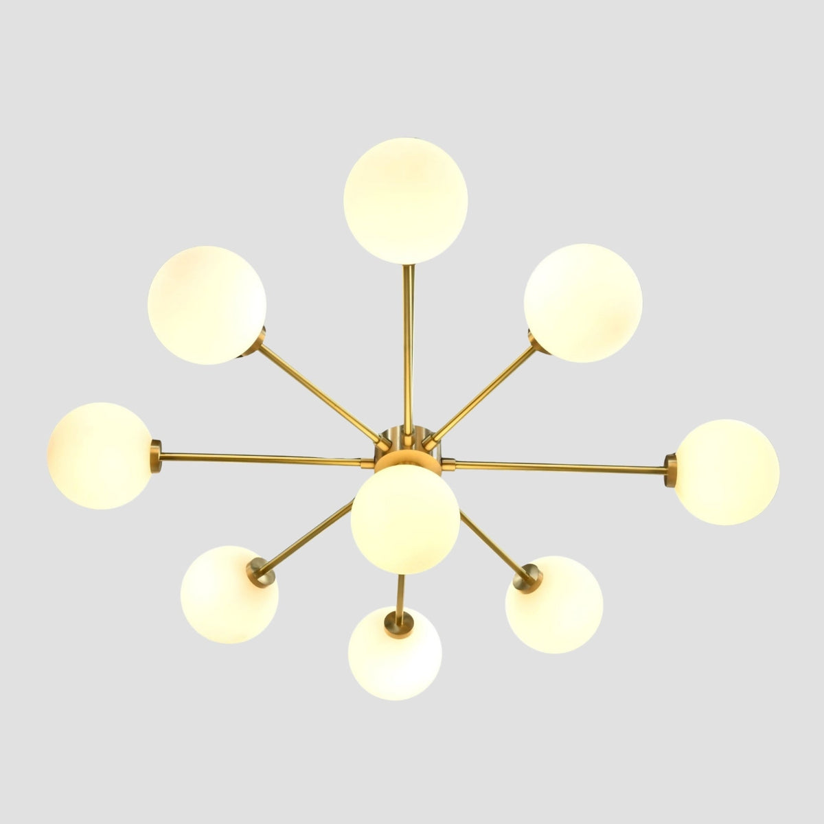 Brass ceiling fixture with nine round glass globe lights creating soft ambient illumination for modern interiors