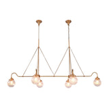 Brass linear chandelier with six glowing ribbed glass globes creating warm ambient light for modern luxury spaces