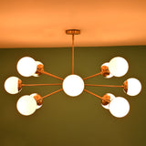 Brass globe chandelier emitting warm ambient lighting ideal for dining rooms and living spaces