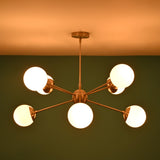 Brass globe chandelier emitting warm ambient lighting ideal for dining rooms and living spaces