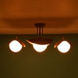 Wide view of 4 light brass flush mount ceiling fixture creating ambient lighting across the ceiling