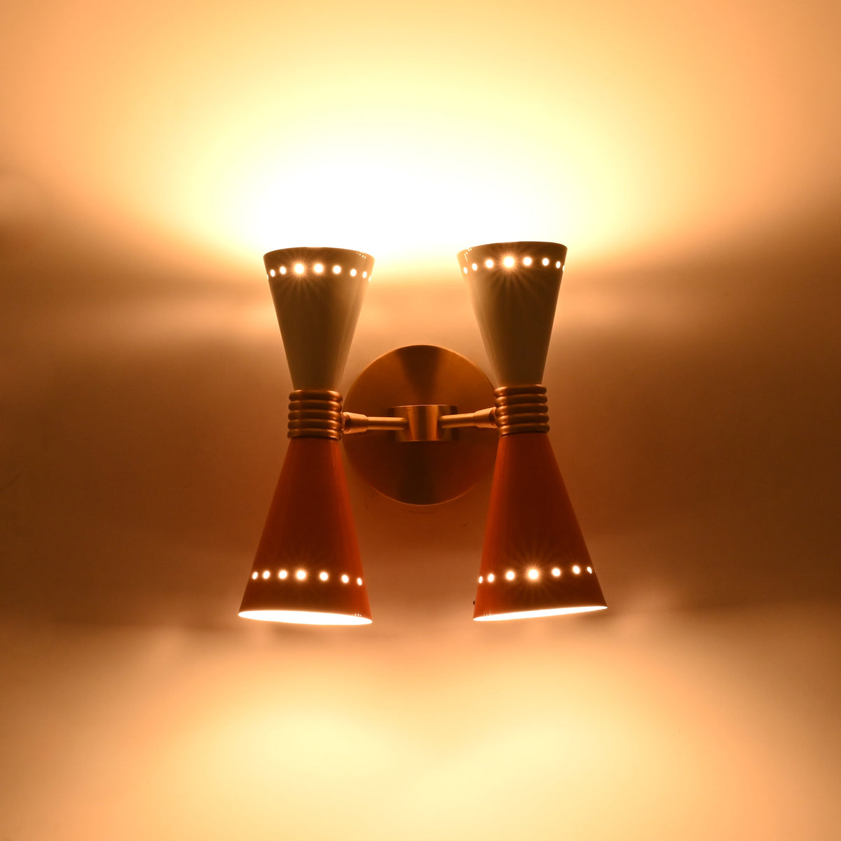 Brass Leaf Studio dual wall sconce with solid brass construction and retro diabolo shade design