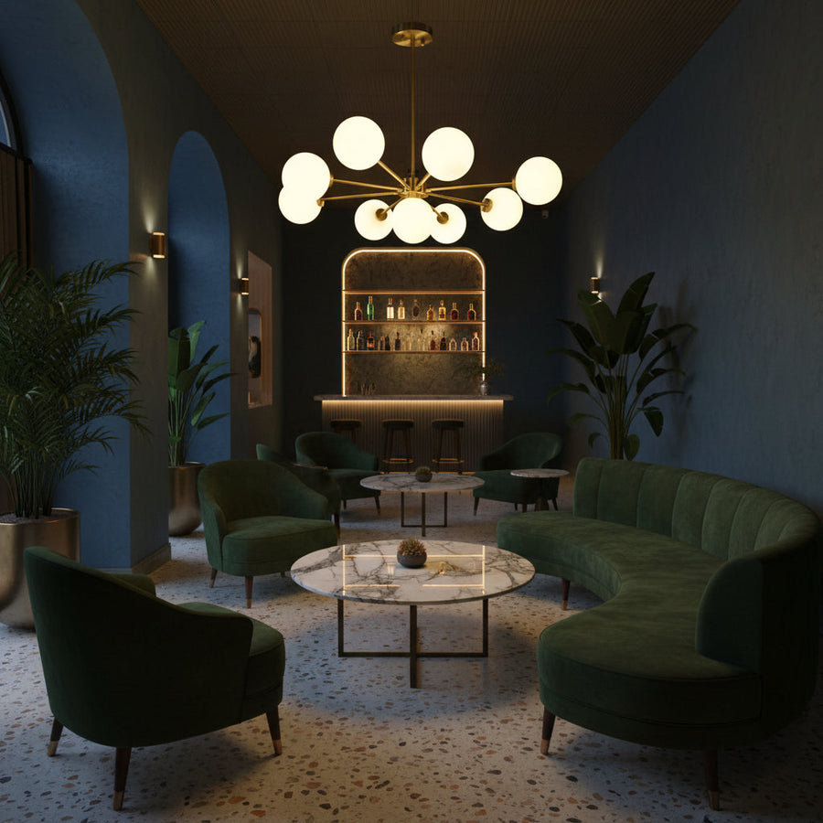 Brass Leaf Studio Naples chandelier featuring nine glass globes, brushed brass finish, and starburst design