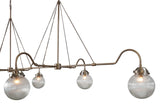 Close-up of ribbed glass globes and brass frame detailing – handcrafted linear chandelier by Brass Leaf Studio