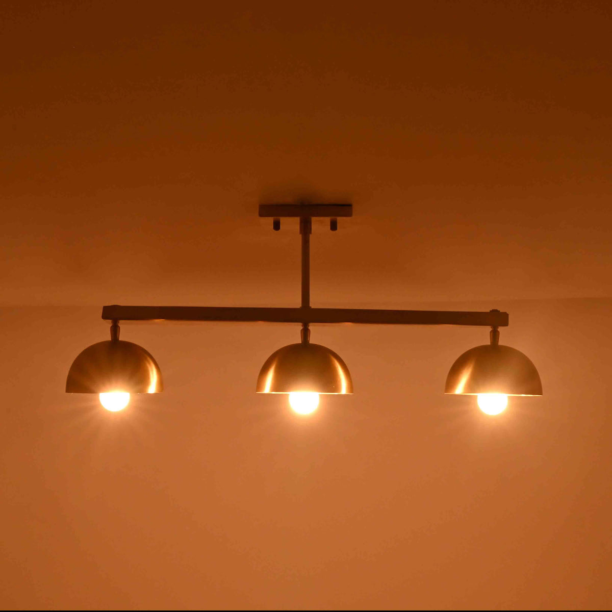 Brass Leaf Studio semi flush ceiling light with solid brass components and three dome shades for refined interiors
