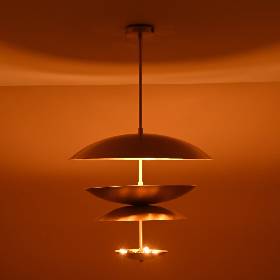 Handcrafted triple bowl brass pendant light with minimalist sculpted design in brushed lacquer finish