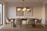 Brass linear chandelier with five oval opal glass balls arranged on a sculptural ceiling frame