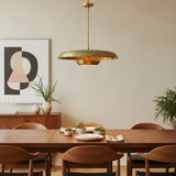 Brass patina disc pendant light with layered bowl design and slim downrod for dining room and living room interiors