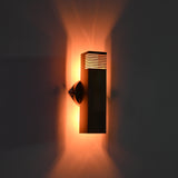 Brass patina hallway wall sconce with slim rectangular tube design and warm decorative lighting for contemporary spaces