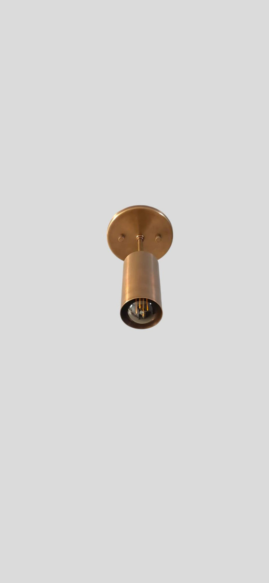 Adjustable brass ceiling spotlight in brushed brass finish, handmade by Brass Leaf Studio