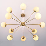 Bottom view of brass sputnik chandelier showing radial arms and evenly spaced opal glass globes