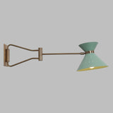 Side profile of brass swing arm wall light with long adjustable reach and minimalist cone shade, ideal for reading and task lighting.