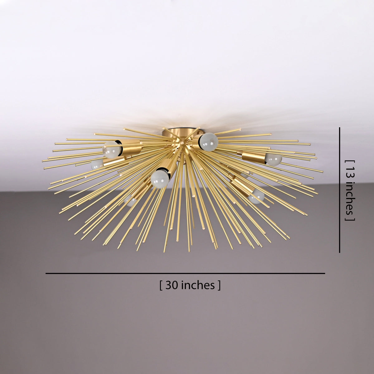 30-inch brass urchin flushmount chandelier in brushed brass finish, front view showing sculpted radial rods and warm ambient lighting.