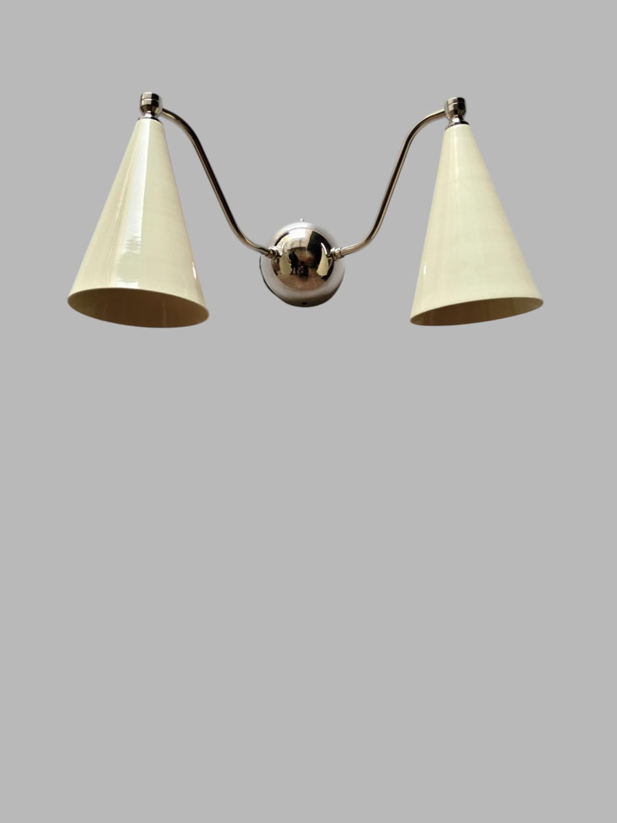 Dual cone wall sconce with polished brass body and white cone shades, modern handmade lighting by Brass Leaf Studio.