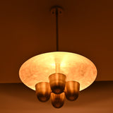 Handmade brass disc chandelier casting indirect ambient light, four bowl design ideal for dining rooms and living spaces