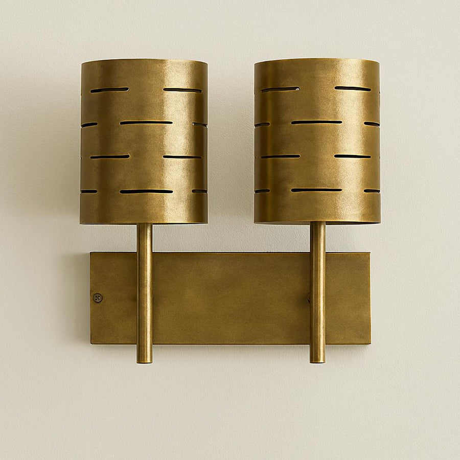 Brushed brass dual wall sconce with two cylindrical perforated shades, mid-century modern industrial wall light fixture