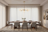 Brushed brass Sputnik chandelier with nine glowing glass globes creating warm ambient ceiling lighting