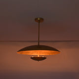 Detail view of brushed brass pendant ceiling canopy and solid brass drop rod connection.