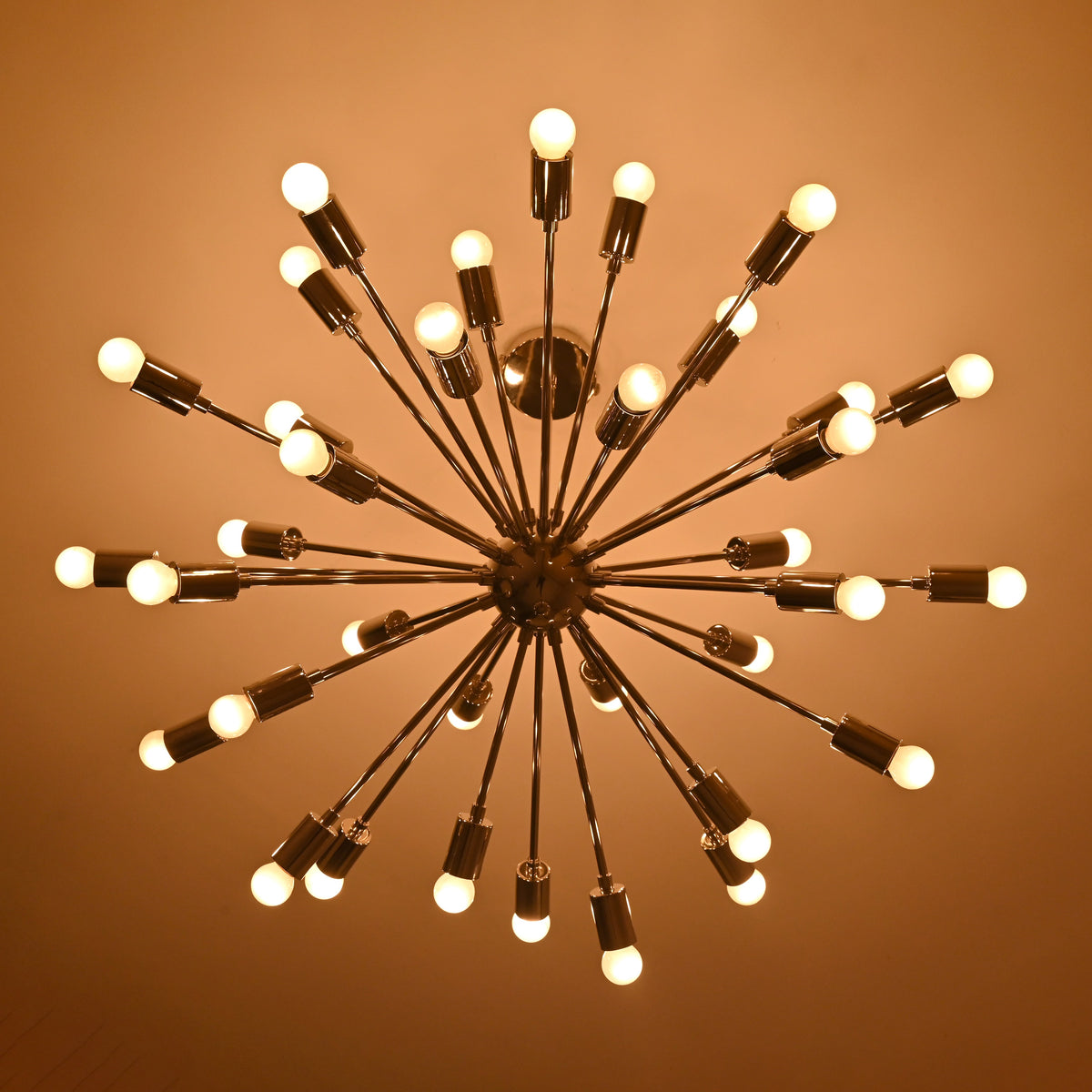 Top glowing perspective of handmade chrome Sputnik chandelier with uniform circular bulb arrangement