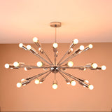 Illuminated 36-light chrome Sputnik chandelier casting warm ambient glow in a modern interior space