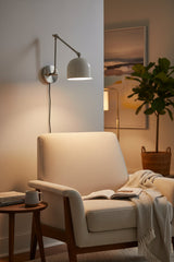 Copenhagen wall sconce dimension view showing 17 inch projection and 8 inch height with adjustable articulated arm