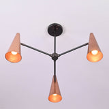 Angled view of copper cone chandelier emitting warm ambient light from three cone shades