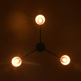 Copper cone chandelier producing focused downward light patterns on ceiling and space below