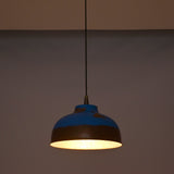 Multiple blue copper pendant lights arranged above a kitchen island for stylish task lighting