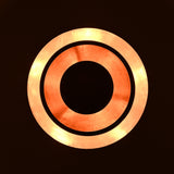 Side view of the lit copper brass chandelier, displaying layered bowl shades and soft ambient illumination.