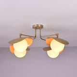 Angled view of Curva curved shade brass ceiling light highlighting sculpted forms and refined brushed brass finish.