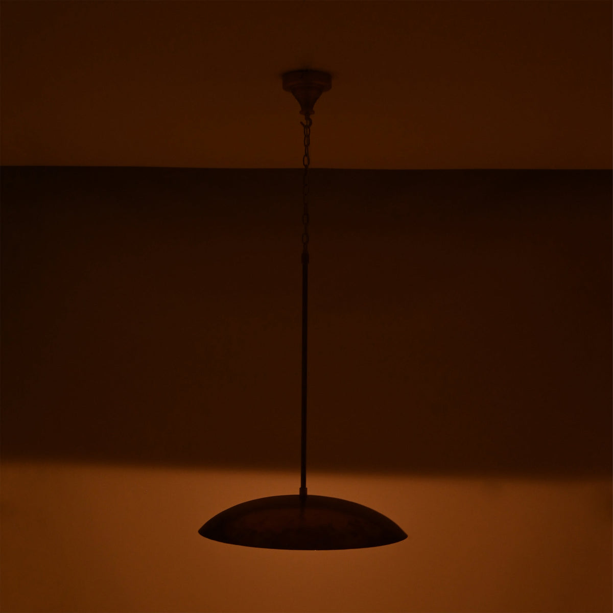 Custom brass pendant light ceiling fixture with adjustable drop length, elegant dome shade, and warm focused glow