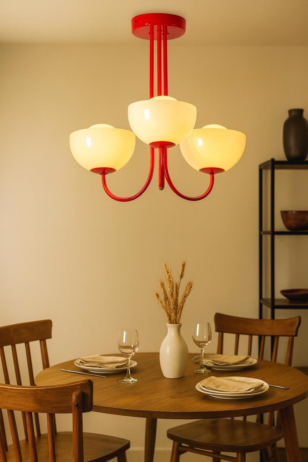 Custom color 3-light bowl glass chandelier showcasing a bold painted finish over a dining table