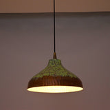 Custom copper pendant light with black cord, copper canopy, and green patina dome shade for modern rustic interiors