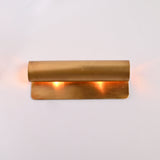 Customizable linear up down wall light with solid brass construction and warm ambient lighting effect