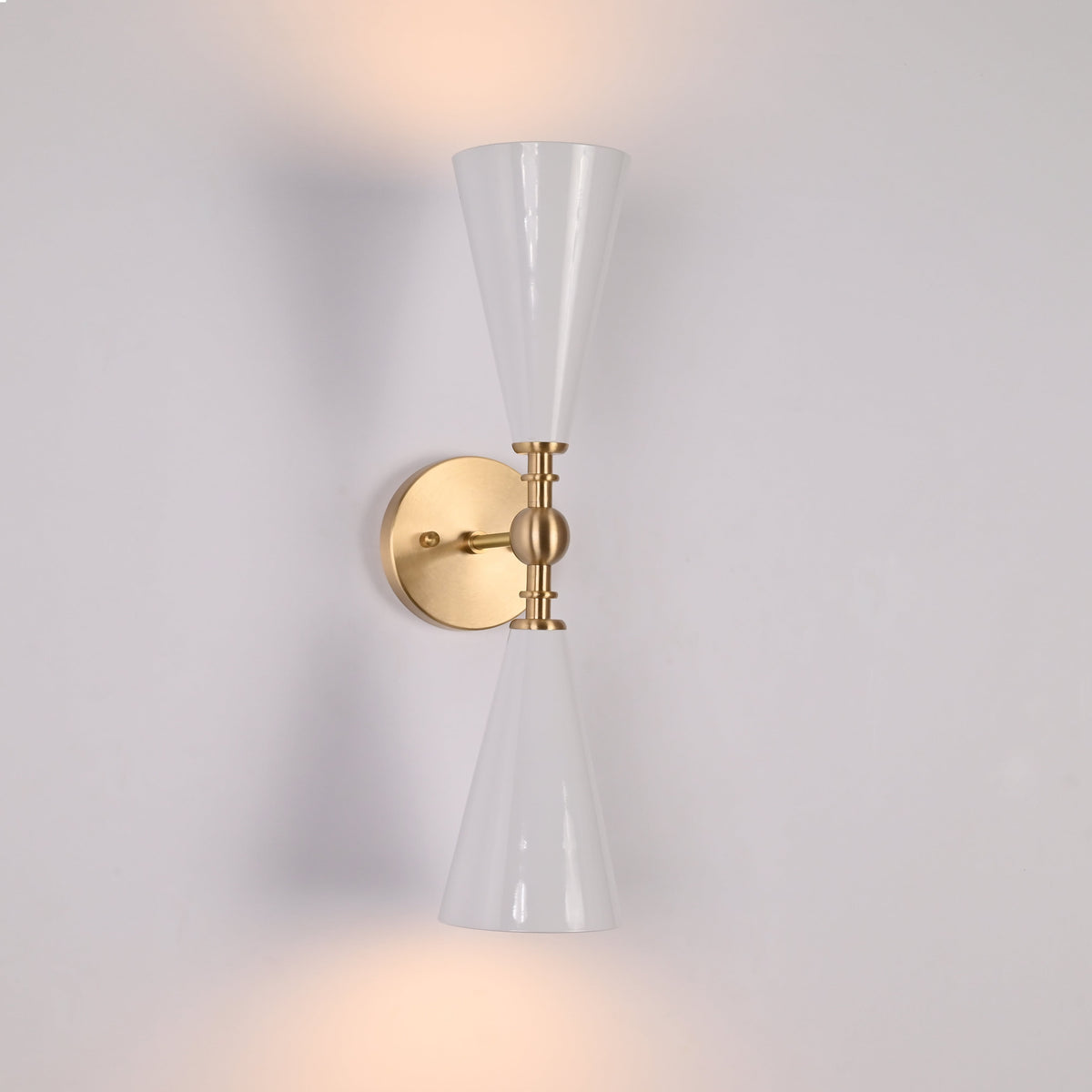 Designer white cone and brushed brass wall fixture with elegant mid century architectural style