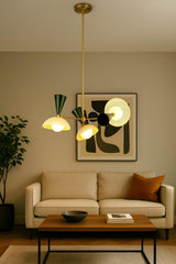 Diabolo style 6 light brass chandelier installed in a modern living room with warm ambient lighting