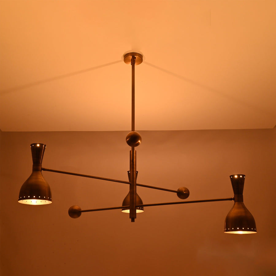 Diabolo 6-light brushed brass chandelier with sculptural arms and bowl-shaped shades, handcrafted in solid brass by Brass Leaf Studio.