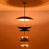 Full view of illuminated Eclipse Cascade Chandelier creating elegant layered ambient illumination