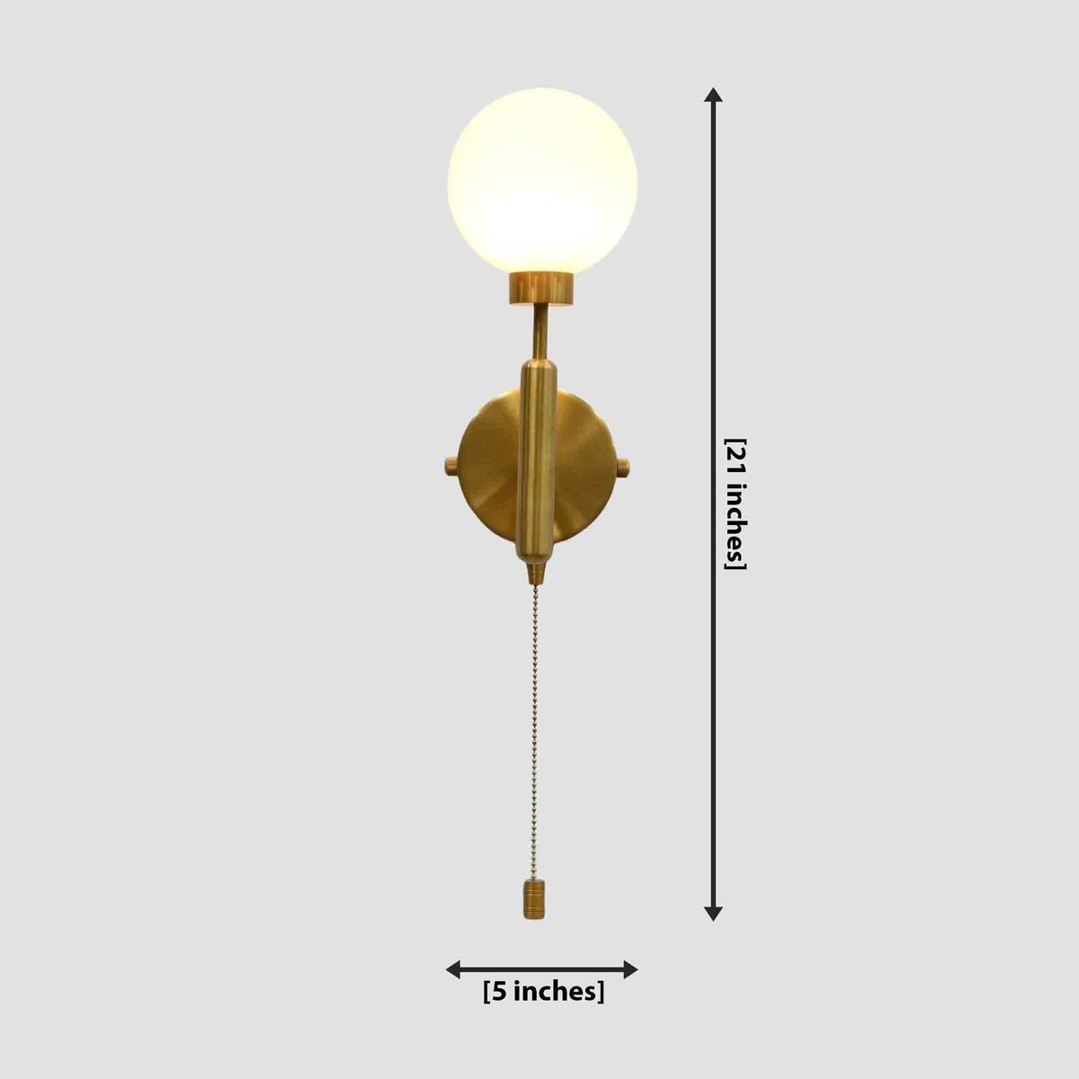 Dimension diagram of a raw brass pull chain globe wall sconce, showing 21-inch height and 5-inch width with lit glass globe shade.