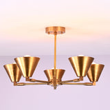 Ceiling-mounted five-light brushed brass chandelier with balanced arms and cone-shaped shades.