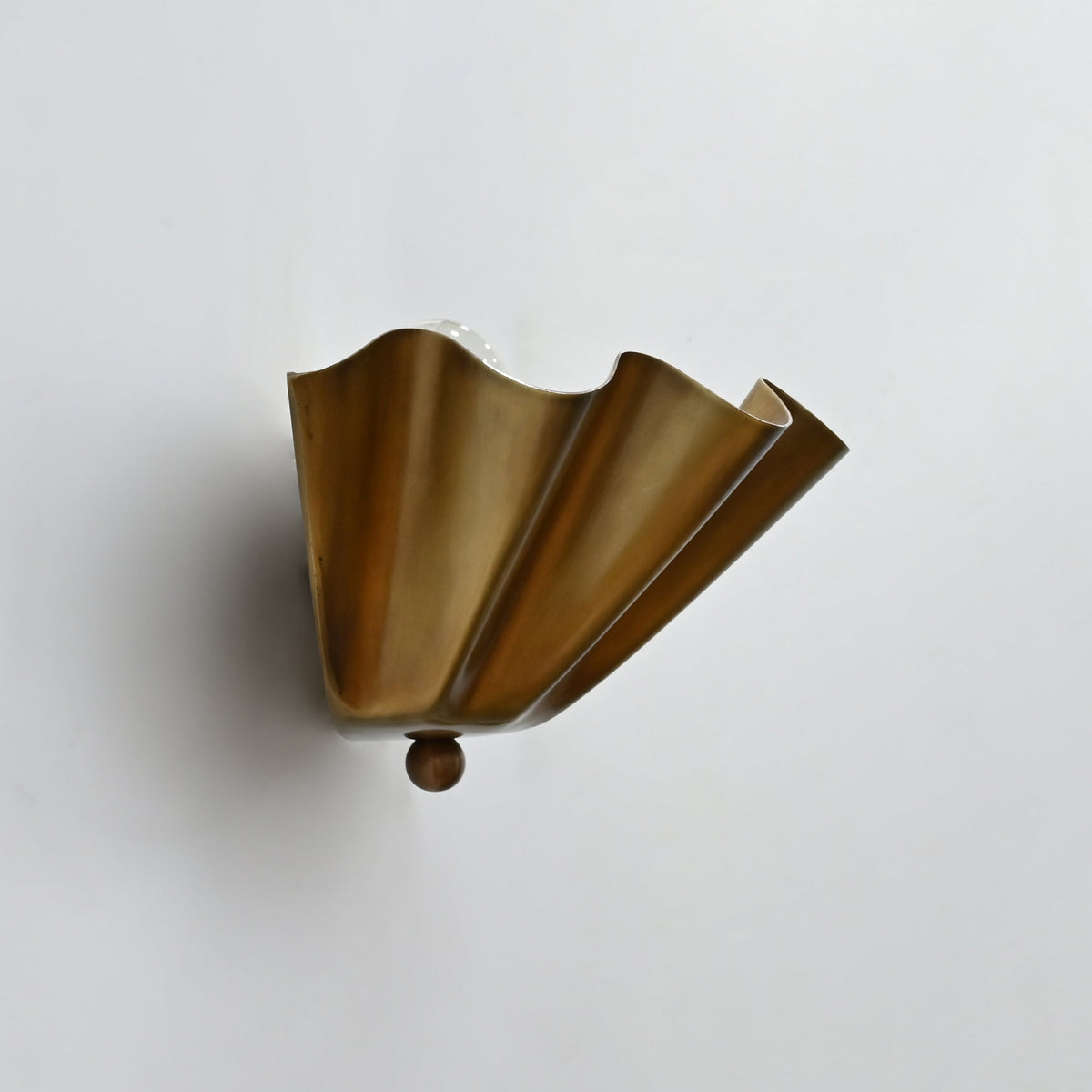 12 inch wide fluted brass wall sconce with scalloped shade design for hallway, bedroom, or entryway lighting