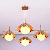 Angled view of four-light brushed brass chandelier highlighting sculpted shade details and craftsmanship.
