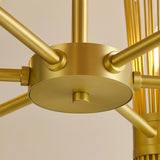 Detailed view of the central hub and arms of a handcrafted brass chandelier highlighting solid brass construction and brushed satin finish.