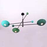 Handcrafted sculptural disc chandelier with multi-arm design and colored bowl shades in modern brass finish