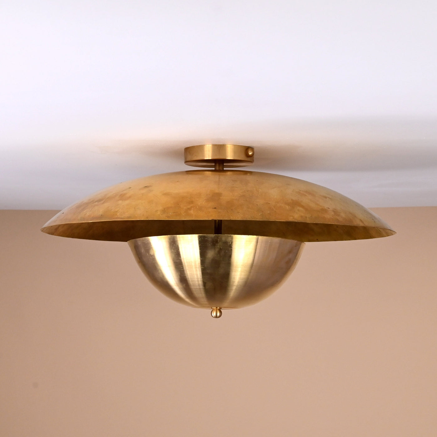 Handmade brass disc flush mount light featuring dual bowl structure with polished brass finish for modern interiors